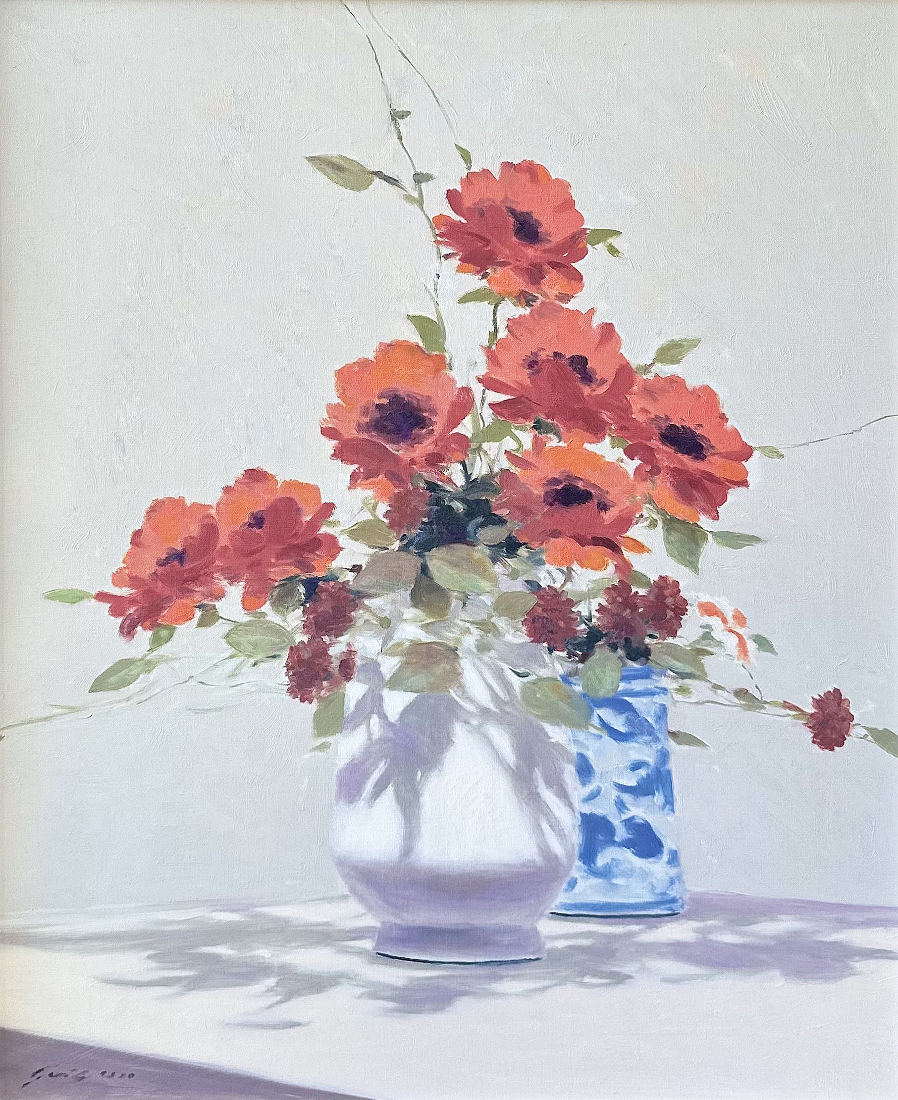 Still life with a vase of red flowers,